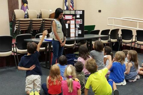 Ramesh at the Cedar Park public library teaching about sugar to young kids.