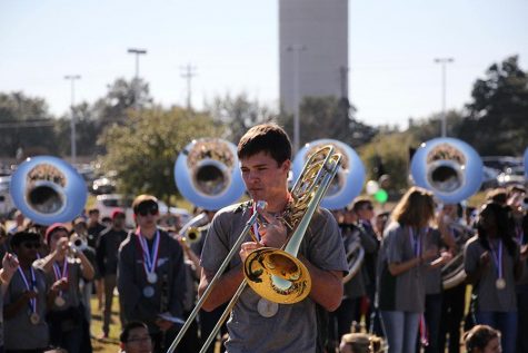 The band played at the parade on Jan. 23 to commemorate their state win earlier this year. Marching season favorites such as Metal Shop were played as the parade progressed. "It was a little weird to play stand tunes and march again after all the time off marching season, " sophomore Claire Sears said. "But it was really fun to get to hang out with the band members I don't get to see during concert season."