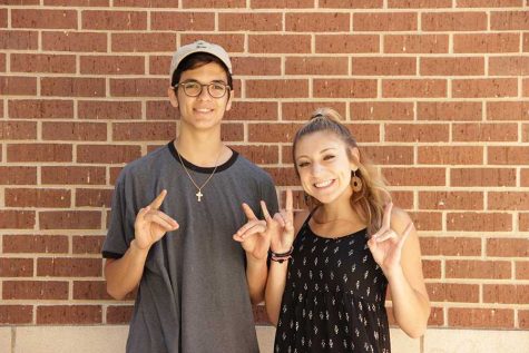 Sporting the T-Wolf sign, Ben Prasifka and Kaitlyn Kuerth give off their school pride. 